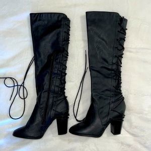 Knee high lace up heeled boots